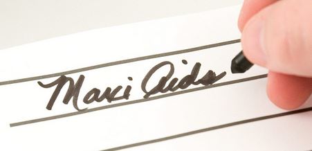 Someone is using the pen to show how boldly it writes.They are writing out Maxi Aids