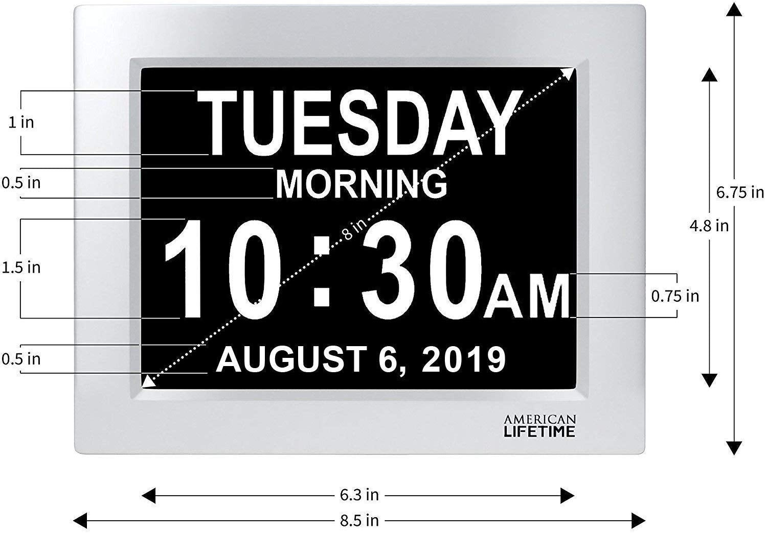 Silver and black clock displaying the date, time and day